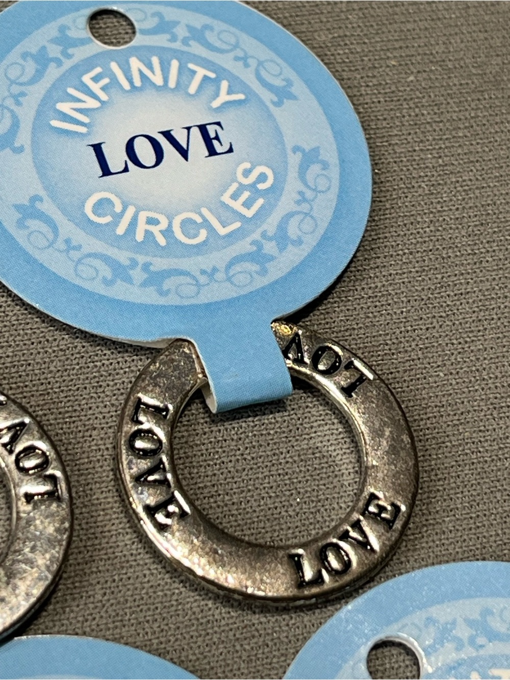 NWT eleven infinity circle imprinted with love.  Layered in sterling silver.